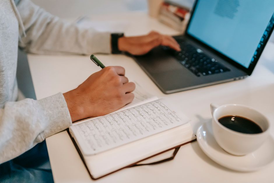 Close-up of a printed cover letter beside a resume on a table